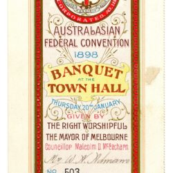 A cream and red invidiation DL sized. There is a red cross at the top and in the centre red block text that reads Banquet Town Hall.