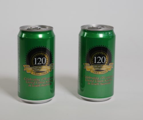 Two green and gold beer cans standing side by side. There is a logo in the centre that reads 125 in celebration of 125 years of the United Trades and Labor Council of SA.